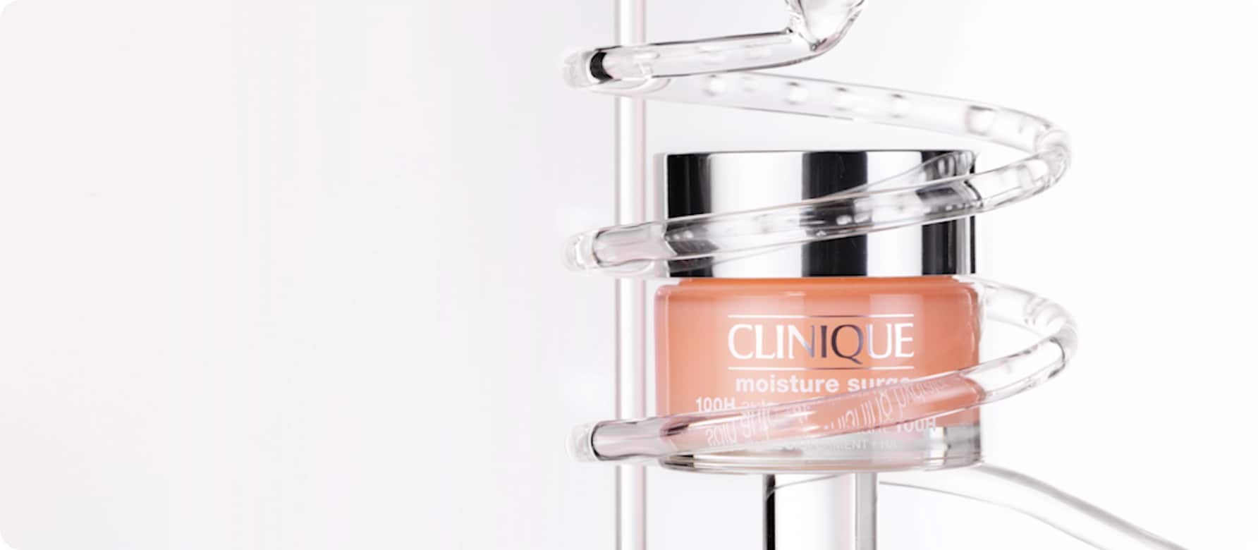 Close up of Moisture Surge 100H Hydrator in front of animated lab glassware, in a brightly lit setting